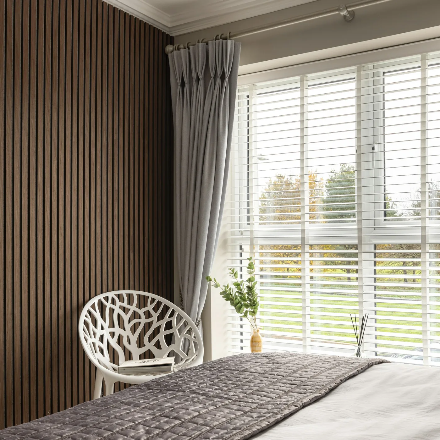 Slatted acoustic panels on felt along the wall of a media room