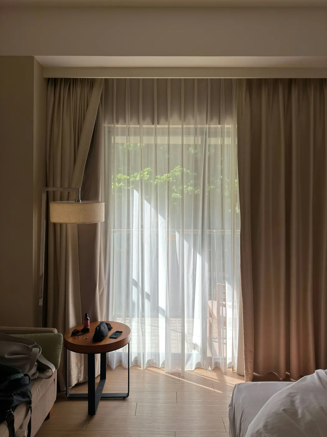 Two-tone double curtains in a plain and a patterned fabric on a double rod