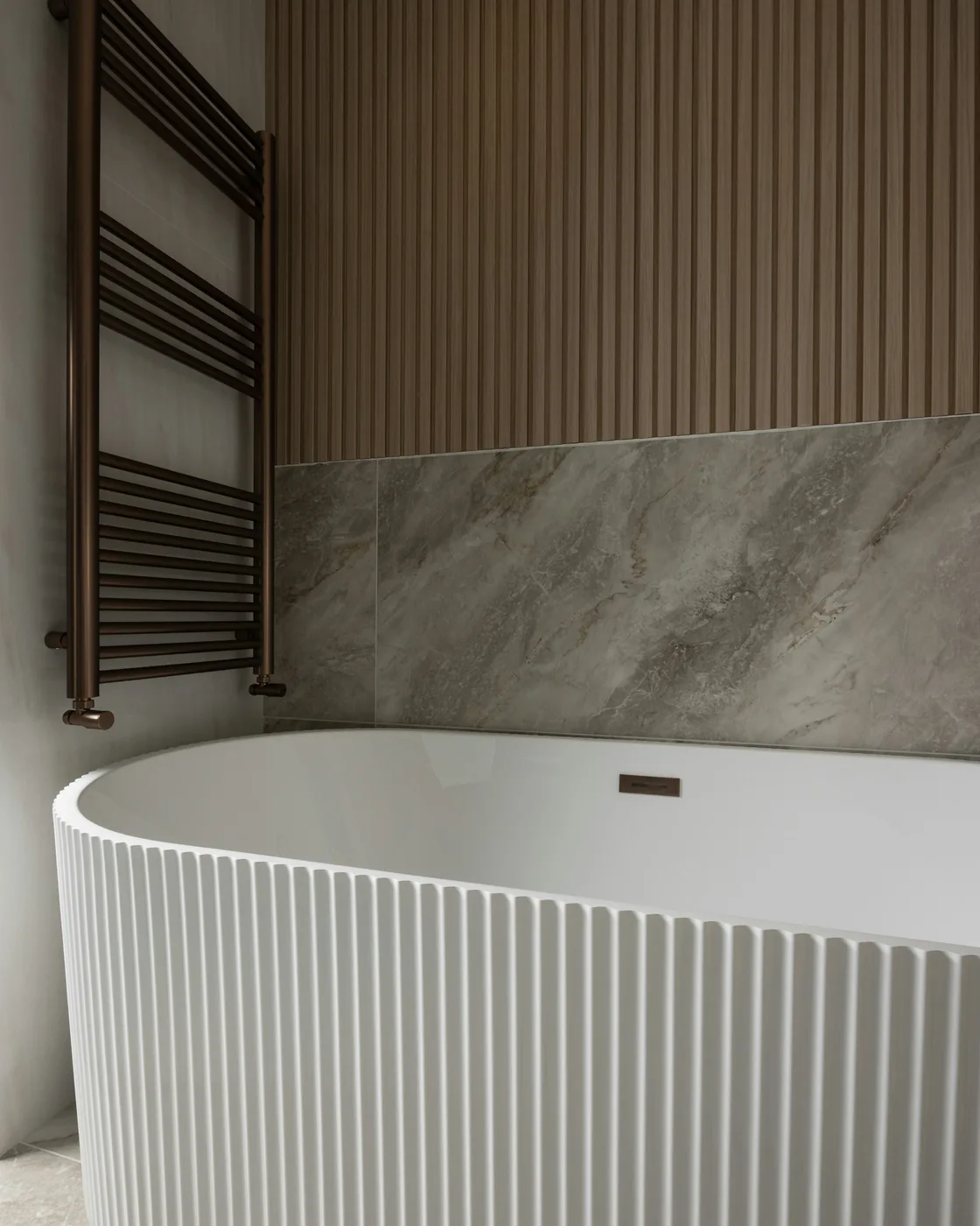 PVC wall panels in a wood-grain finish behind a living-room sofa