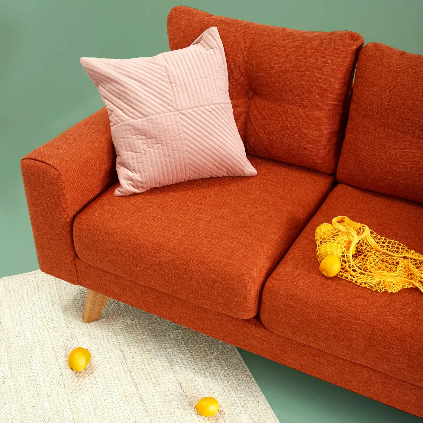 A compact two-seater sofa suited to an apartment living room