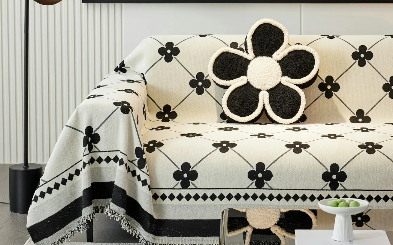A sofa dressed in a fitted, removable fabric cover