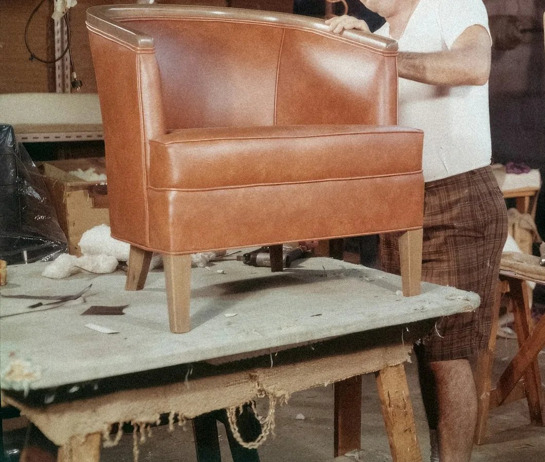 A sofa opened up for repair, showing its frame, springs and foam