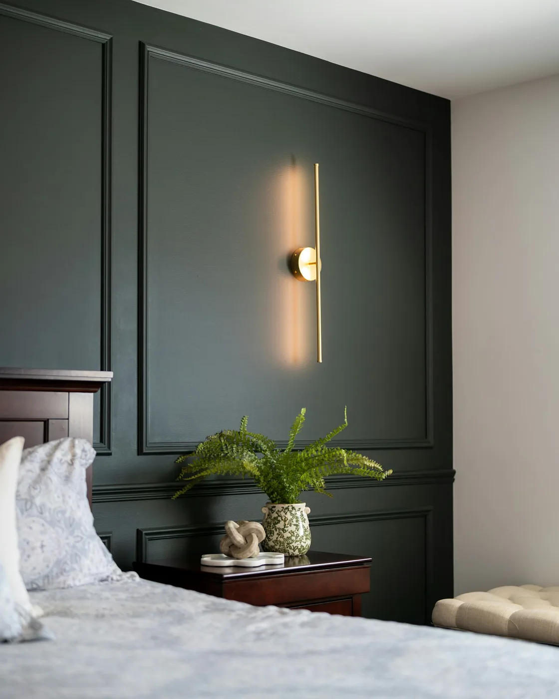 Painted picture-frame wall moulding on a pale living-room wall