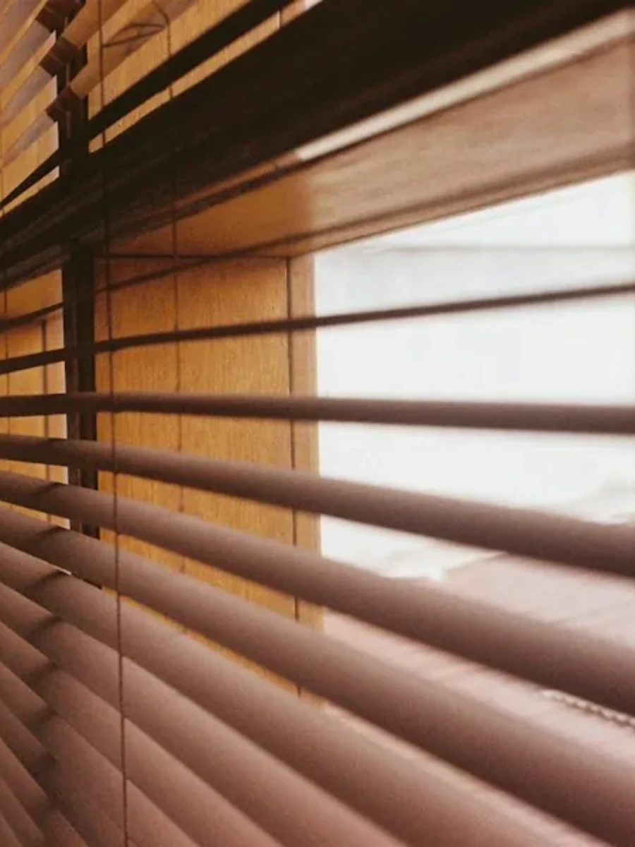Sunlight falling on a tiled floor through a large window in a Goan home