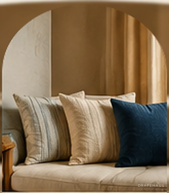 A linen sofa lined with striped, plain and indigo cushions