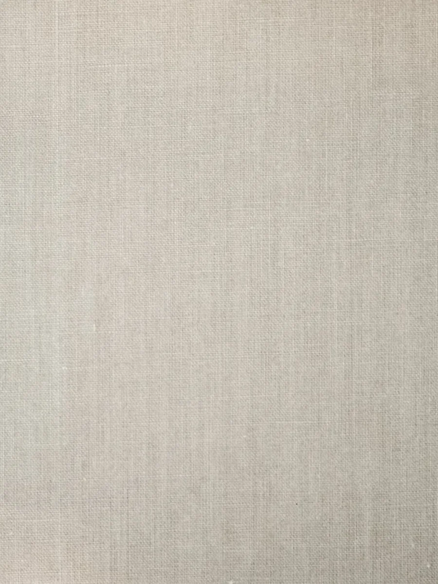 Natural linen curtain fabric falling in soft folds