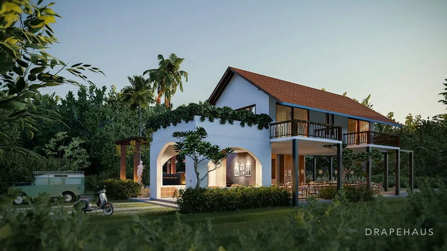 Restored Goan farmhouse interior where an original wall meets a modern glazed extension