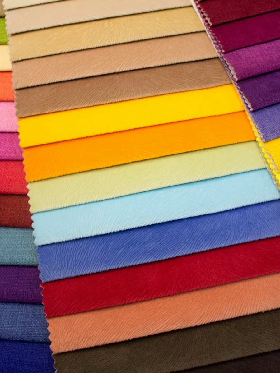 Fanned rows of upholstery fabric swatches in many colours and textures