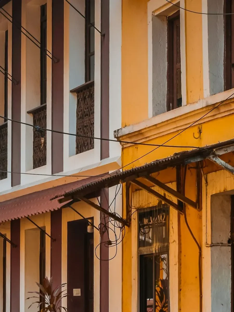 Row of colourful Portuguese-era townhouses with balconies and awnings in Fontainhas, Panjim