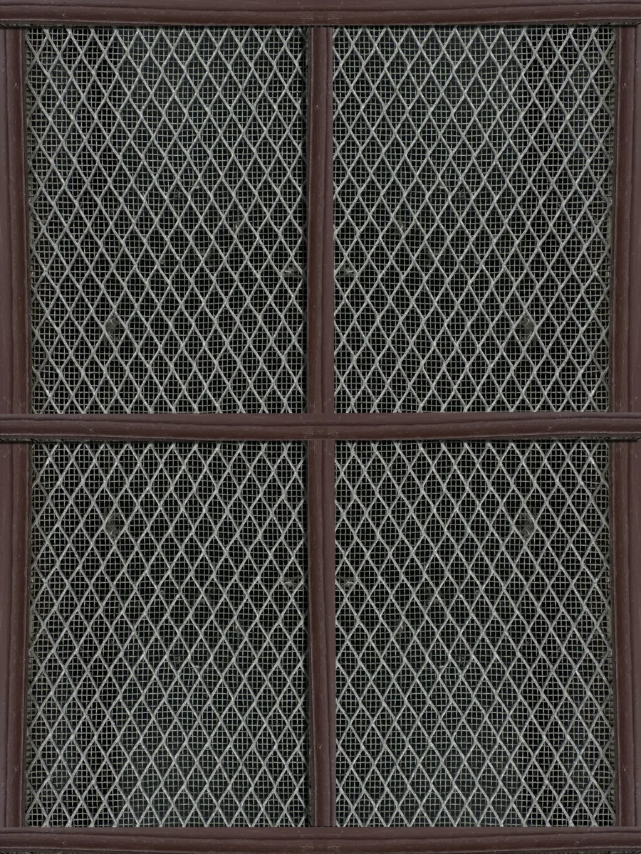 A window fitted with diamond-pattern insect mesh panels in a dark wooden frame