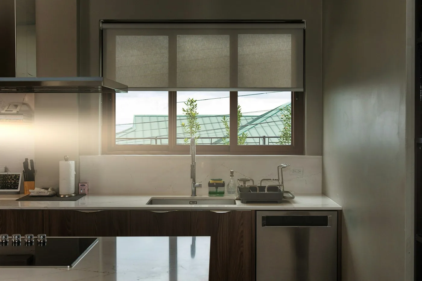 A bright home kitchen with a window above the counter